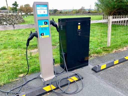 EV Charge Points An electric vehicle charging point located in the car park at the Village Hall